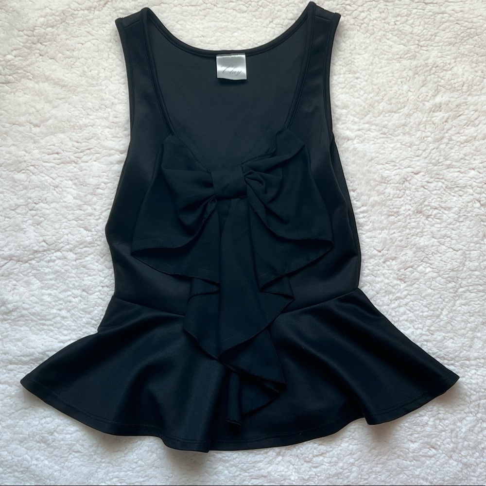 Beautiful, dressy, tank top with black bow design.